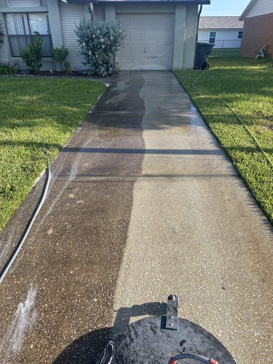 Driveway cleaning surface cleaner Florida residential home — half clean half dirty comparison