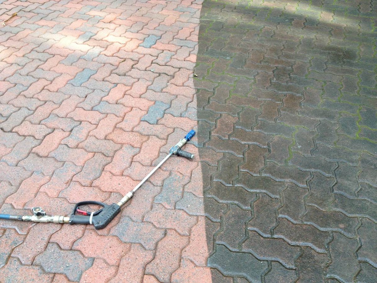 Paver pressure washing before and after Broward County Florida — interlocking brick restored